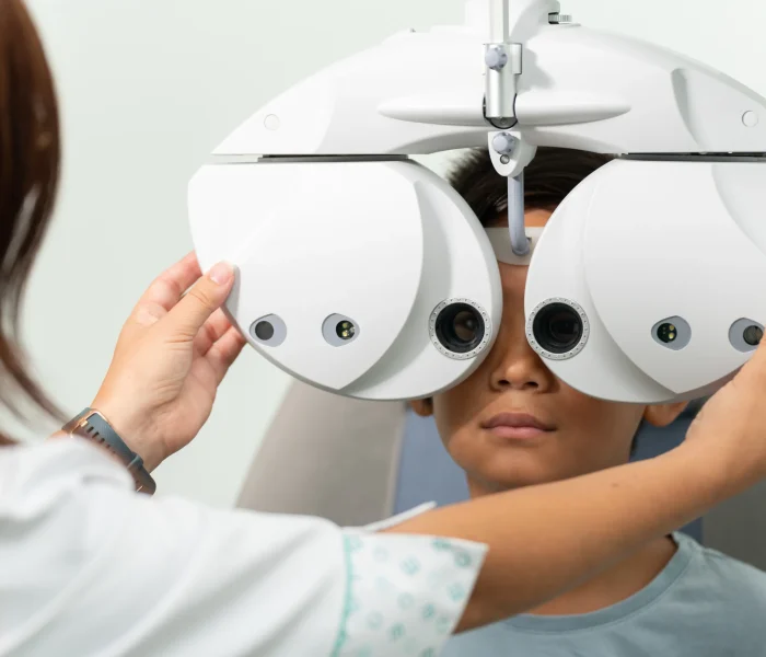 asian-boy-with-a-phoropter-at-an-optometrist-consu-2025-01-09-00-31-58-utc